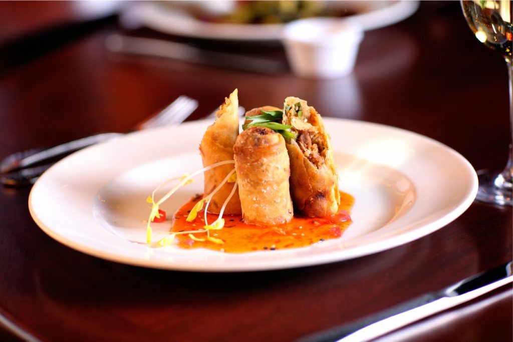kahluachickeneggrollsemerilstchoupchop Central Florida Lifestyle Kahlua Chicken Eggrolls with orange chili dipping sauce at Emerils Tchoup Chop