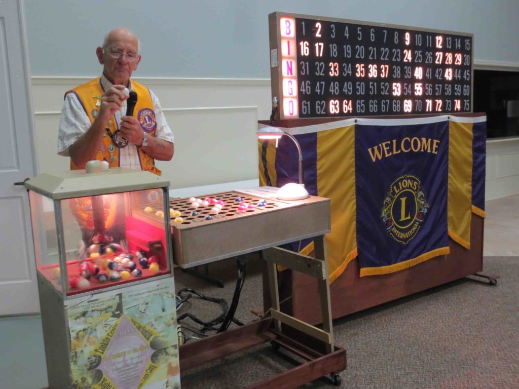 lioncharlessheave Central Florida Lifestyle Soft spoken Lions Club Bingo Chairman Tom Conaughty calling numbers