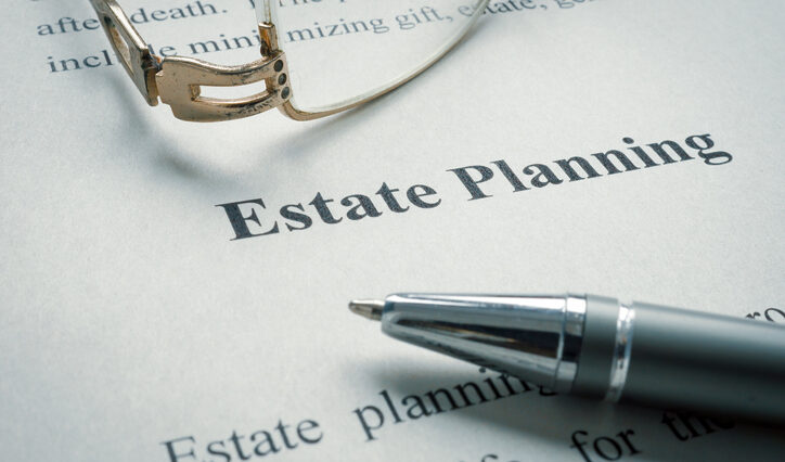 Photo of legal documents about estate planning with a pair of glasses.