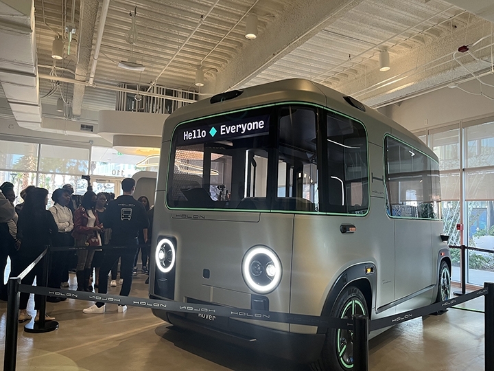 beep4 Central Florida Lifestyle Evan High School students collab with Beep and HFUW and gather around the small autonomous shuttle