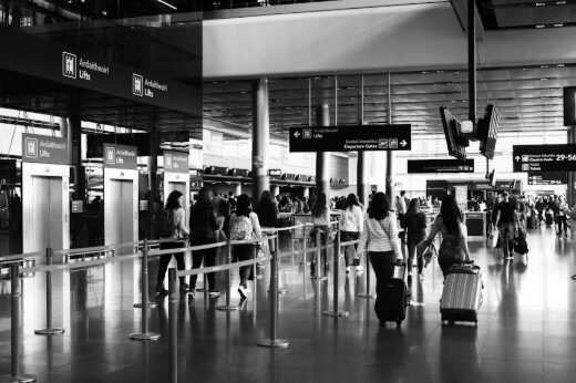 Travelers with suitcases at Orlando airport for an international departure